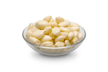 Peeled garlic in a glass bowl isolated on white background. Clipping path.