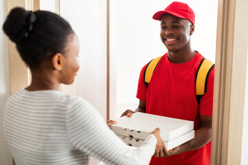 Cheerful Black Courier Standing Holding Pizza Boxes At Customer's Doors
