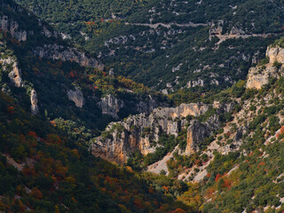 Fototapeta na wymiar Beautiful panoramic view of steep canyon Gorges de la Nesque with rugged limestone rocks on the slopes in the Vaucluse Mountains in Provence, France.