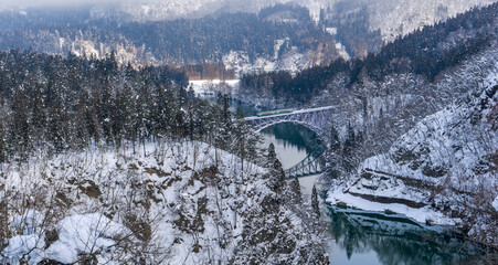 Tadami railway line and Tadami River in winter season at Fukushima prefecture.