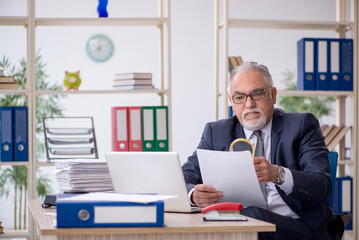 Old male employee and too much work in the office