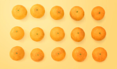 Fruit pattern of fresh orange on yellow background. Top view. Copy Space.