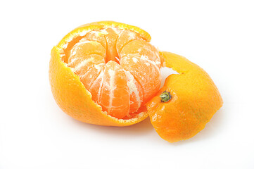 tangerine with peeled peel on a wooden background