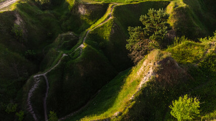 Landscape panorama: mountains, lake, valley, trees and footpath.