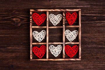 Valentine's day background with hearts in the box on wooden table.