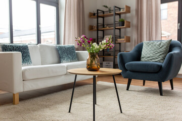 comfort, furniture and interior concept - sofa with cushions at cozy home living room