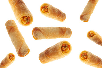 Vegetable spring rolls flying on isolated white background full and cut.
