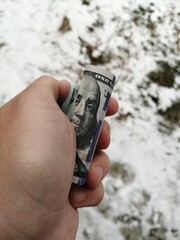 American hundred dollars lying in the hand