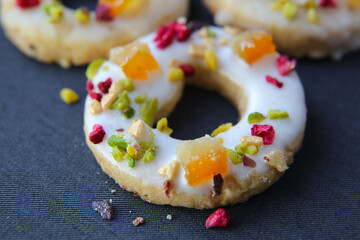 shortbread cookies with candied fruits on a dark background