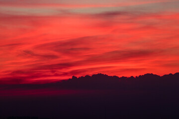 Red or orange sky and clouds at sunset in the evening