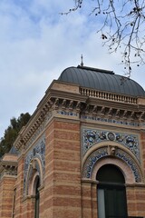 Fototapeta na wymiar Decorative details of the facade of the Palacio de Velasquez in the Retiro park, in Madrid