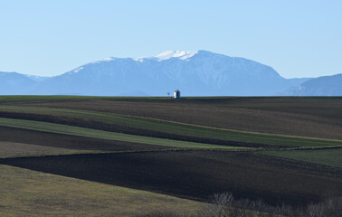 Little chappel in front of the mountains