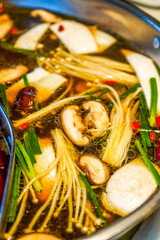 Close-up of the bottom of traditional Chinese Sichuan hot pot, two flavors