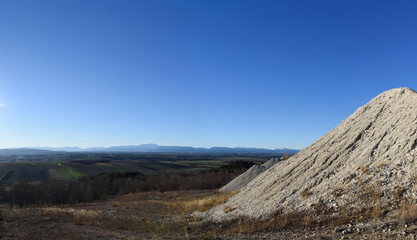 Dump of a chalkmine in front of the mountains