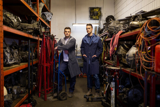 Portrait Confident Young Mechanics In Auto Repair Shop