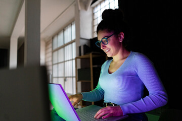 Young businesswoman with laptop working at home office