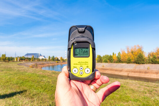 Ukraine, Kyiv Oblast, Chernobyl, Hand of man using Geiger counter to measure radiation levels nearChernobyl Nuclear Power Plant