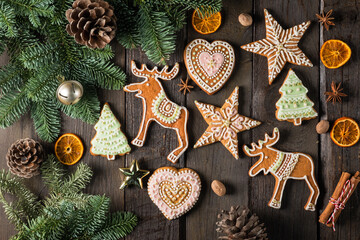 Christmas homemade gingerbread cookies and spices on wooden table 