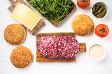 Beef burger ingredients, on white stone  background, top view flat lay