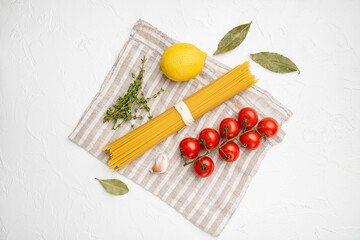 Fototapeta na wymiar Original Italian raw dry pasta, on white stone table background, top view flat lay, with copy space for text
