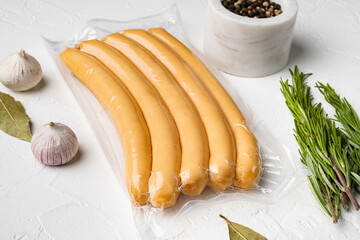 Chicken sausage pack, on white stone table background