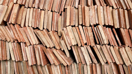 Pile of tiles waiting to be installed as a temple's roof                               