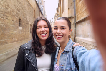 POV Shot Of Same Sex Female Couple Pose For Selfie As They Visit Oxford UK Together