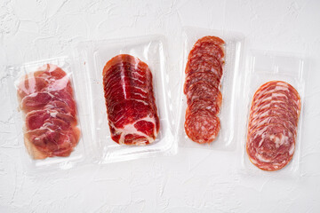 Italian sausage vacuum pack, on white stone table background, top view flat lay, with copy space...