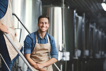 Modern brewery owner, worker at alcoholic beverage factory, workplace of brewer