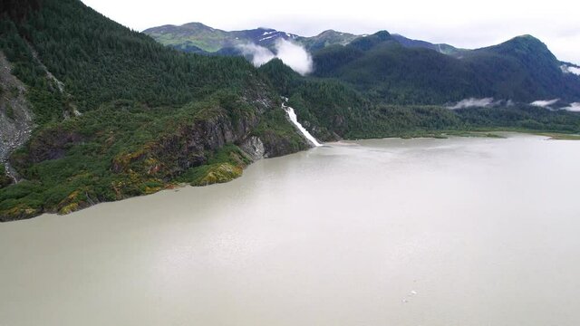 Aerial View of Alaskan waterfall from distance -Nugget Falls