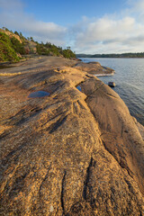 Rocky cliff by the sea at Geta in Åland Islands, Finland, on a sunny day in the summer.
