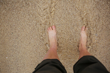 Feet in sand