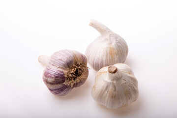 Garlic isolated on white background close up. Raw garlic with clove. Garlic bulb