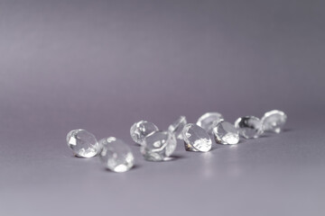 Diamonds out of Glas on a grey Background