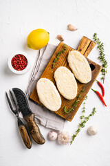 Fototapeta na wymiar Fish burgers with crumbs, on white stone table background, top view flat lay