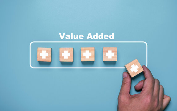 Hand putting plus sign which use download style which mean value added , positive thinking and personal development concept.