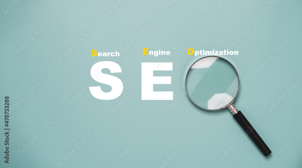 Poster magnifier glass with seo or search engine optimisation wording for search engine concept.