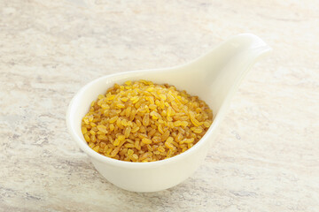 Raw bulgur in the bowl