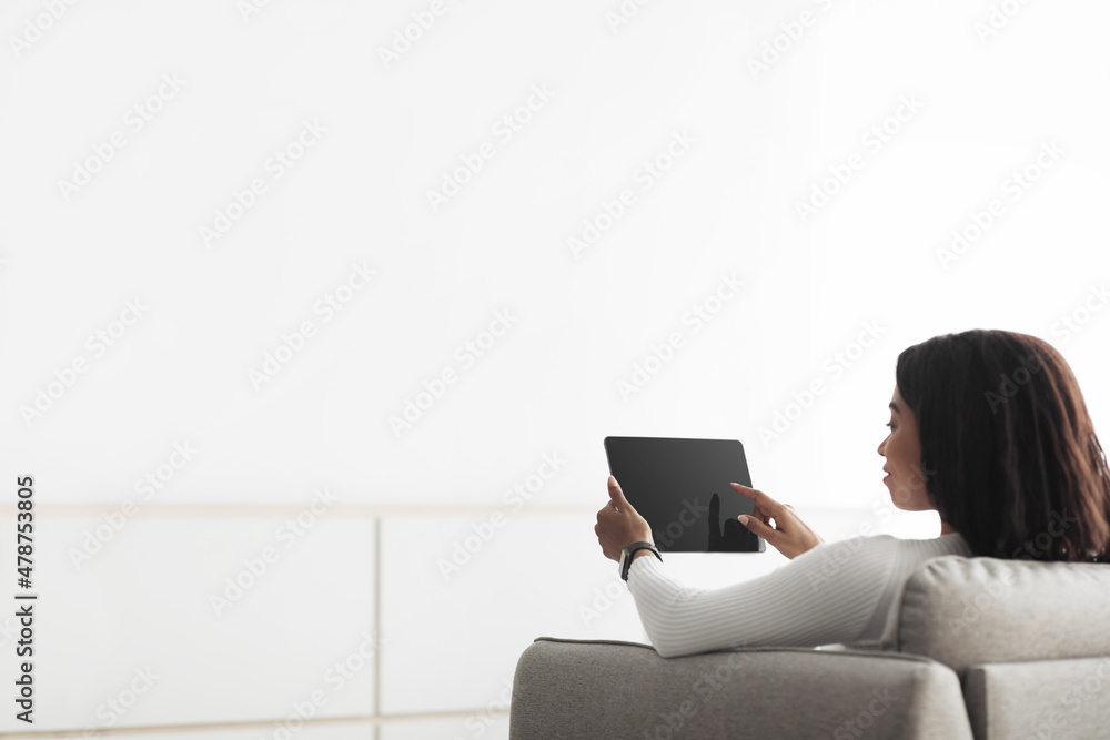 Poster Automation domestic system. Black lady using digital tablet with empty screen and controlling smart home devices