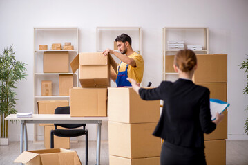 Young female boss and male contractor doing home relocation