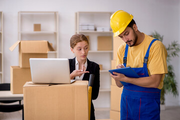 Young female boss and male contractor doing home relocation