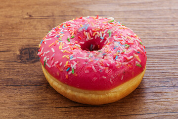Sweet glazed struwberry donut with icing