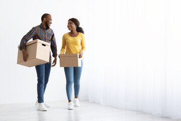 Portrait Of Happy African American Couple Carrying Cardboard Boxes, Full-Length Shot