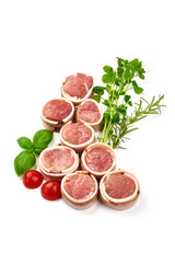 Pork medallions wrapped in bacon. Fresh raw pork tenderloin, isolated on white background.