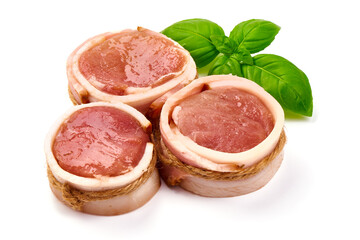 Raw pork tenderloin medallions, isolated on white background.