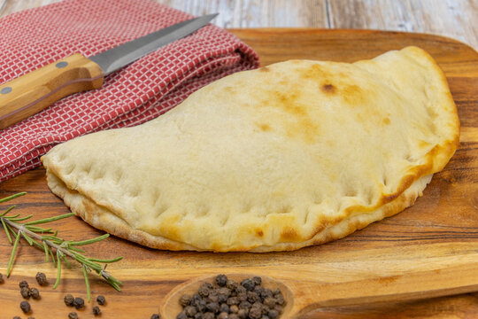 pizza calzone on a decorating board