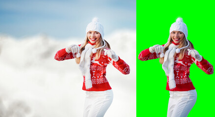 Obraz premium Young woman wear red winter pullover, white hat, smiling, hands in air, blurred snow country background, free space for text left side, isolated selection on green background included