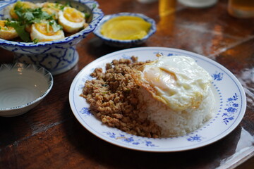 thai rice with pork and egg. a popular thailand dish.