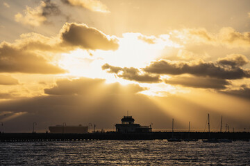 Obraz premium Pier Summer Sunset with Ship Passing on the Horizon 