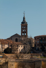 Fototapeta na wymiar City skyline of Segovia, Spain, against blue sky